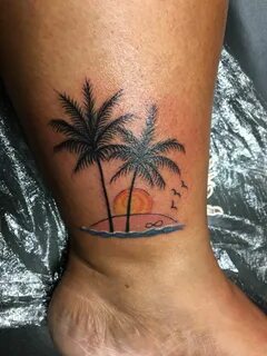 Palm Tree Tattoo with a beautiful sunset on a beach. Infinit