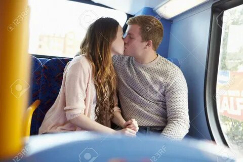 Romantic Teenage Couple Kissing On Bus Фотография, картинки, изображения и сток-