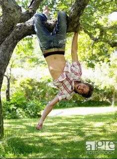 Take a picture holding a sign in front of a tree by Conangar