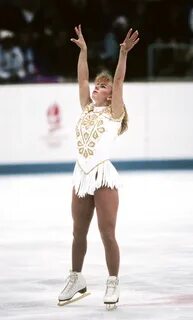 See how Olympic figure skating costumes have changed through