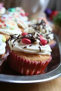 Colorful sweet muffins garnished with whipped cream free ima