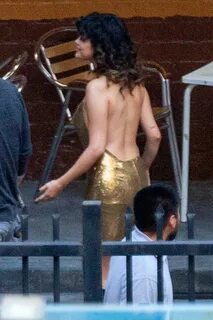 selena gomez stuns in a backless golden dress during a music video shoot in...