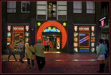 Late at night.... Amsterdam’s last peep show. Red Light Di. 