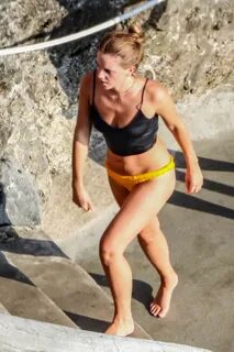 emma watson spotted in a black crop top and yellow bikini bo