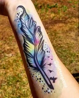 Rainbow watercolor feather Face painting by Glitter Goose! E