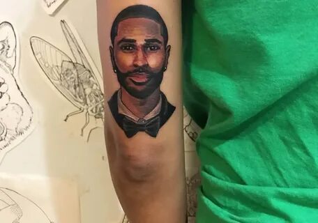 Jhene Aiko tattoos detailed image of Big Sean on her arm