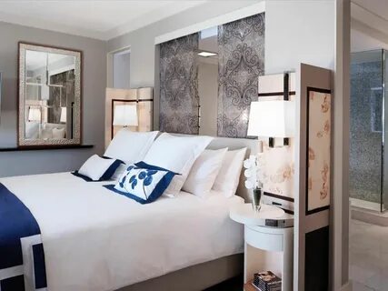 Gray Contemporary Bedroom With White and Navy Bedding Hotels