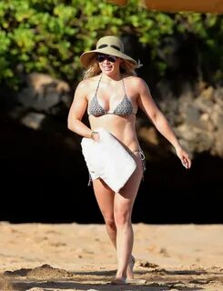 Hilary duff showing off her curvy bikini body at a beach Hol
