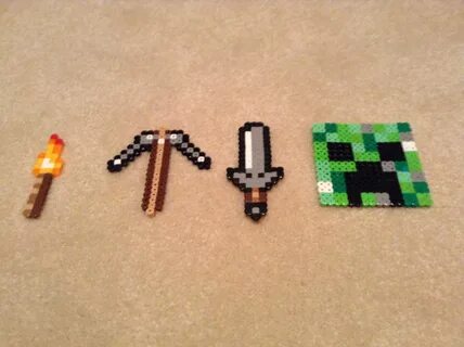 Minecraft Perler beads creeper, pick axe, torch, and sword. 