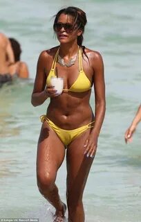 A ray of sunshine! Claudia Jordan, 40, sips cocktails and di