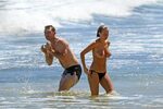 Busty Lara Bingle tanning nude on a beach in Hawaii