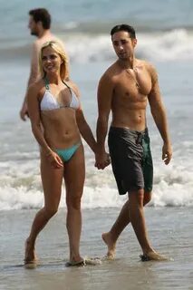 A Bikini clad Kelly Sullivan spotted on the beach with her s