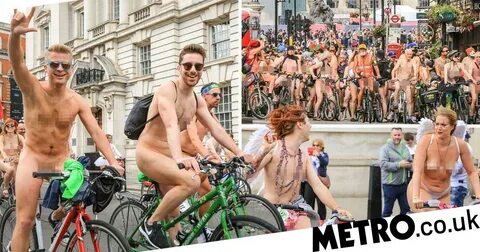 Naked cyclists pictured riding through London on Boris bikes