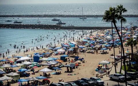 Photos: Beach crowds seek relief from heat along the coast -