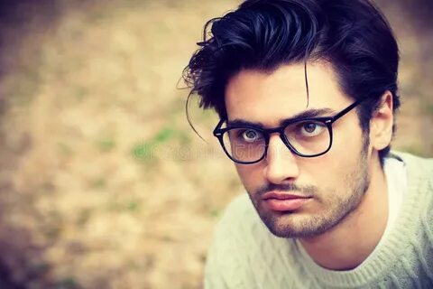 Portrait of Young Handsome Man in White Shirt Outdoor. Stock