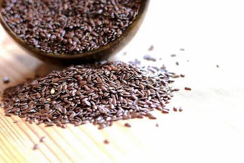 flax-seeds-spilling-from-bowl - Afrocart