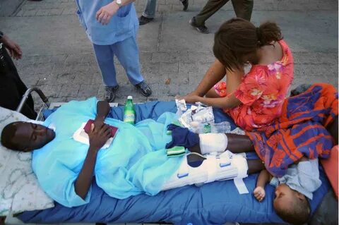 File:Haitian family outside University Hospital, Port-au-Pri