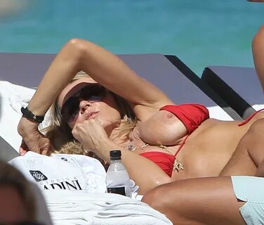 Rita Rusic boob slip on a beach