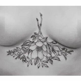 Leaves around boob tattoo