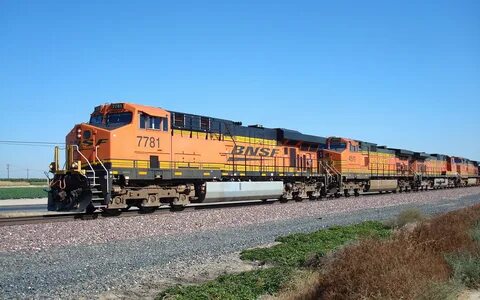 Yellow and black concrete building, freight train, diesel lo