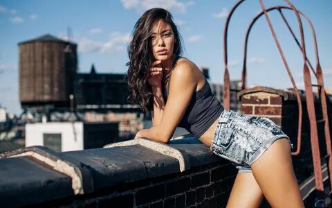 Brunette in short shorts on the roof-Beauty Photo Wallpaper 
