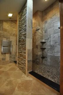 Stone wall instead of shower doors makes for a great walkin.