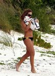 Mariah Carey topless playing with her doggy on a Caribbean b