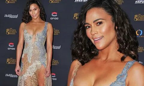 Paula Patton shows off her ample cleavage in barely there dr