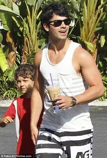 Joe Jonas flaunts his biceps on hike with adorable younger b