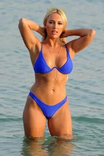 amber turner wears a blue bikini during a beach day in dubai