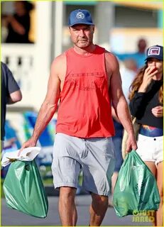 Liev Schreiber Shows Off His Arm Muscles in Red Tank Top: Ph