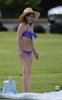 Evangeline Lilly shows off her curvy body in skimpy purple b