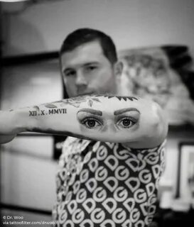 Single needle eyes tattoo on Canelo Álvarez's forearm. Eye t