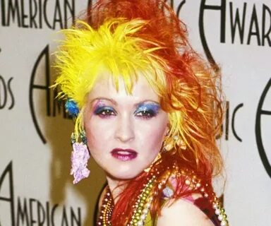 Signature yellow orange hair color or Cyndi Lauper. Cyndi la