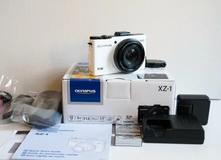 Olympus XZ-1 White 2 original batteries, an extra wall charg