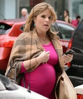 Jenna Bush shows off growing baby bump in a bright pink figu