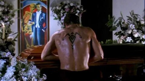 Fake tattoo on the back of Scott Bakula from the movie Lord 