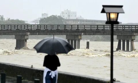 Hundreds of thousands evacuated in Japan as 'historic' rain 