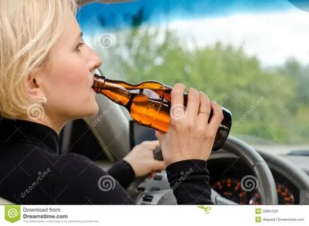 Woman Alcoholic Drinking As she Drives the Car Stock Image -