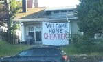 Unfaithful soldier's wife welcomes him home with sign that s