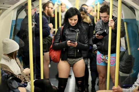 A man checks out a woman travelling on a New York subway train in her under...