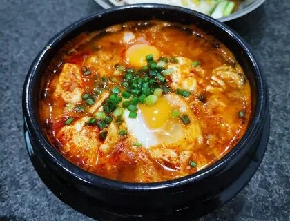 Sundubu-jjigae (순두부찌개) Spicy soft tofu stew with kimchi and 