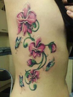 Nice pink orchids with butterflies tattoo on ribs Orchid tat