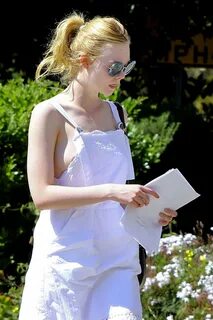 Elle Fanning Wardrobe Malfunction in White Dress out in LA