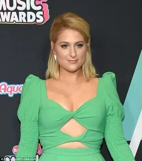 Meghan Trainor flashes cleavage and her giant engagement rin