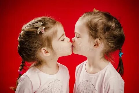 Two Sisters Give Each Other Kiss Photos - Free & Royalty-Fre