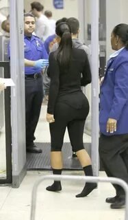 KIM KARDASHIAN in Tight Leggings and Socks at LAX Airport - 