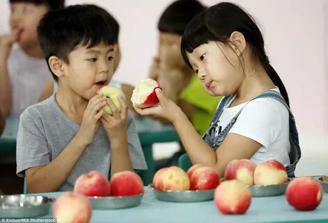 How Chinese kids chomp their way through whole watermelons D