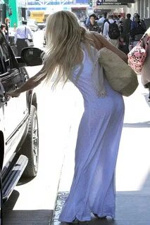 Watch out! Pamela Anderson jets into LA in see-through white