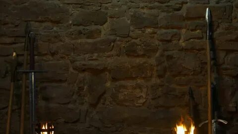 stone wall torches illuminate fortress medieval: стоковое ви